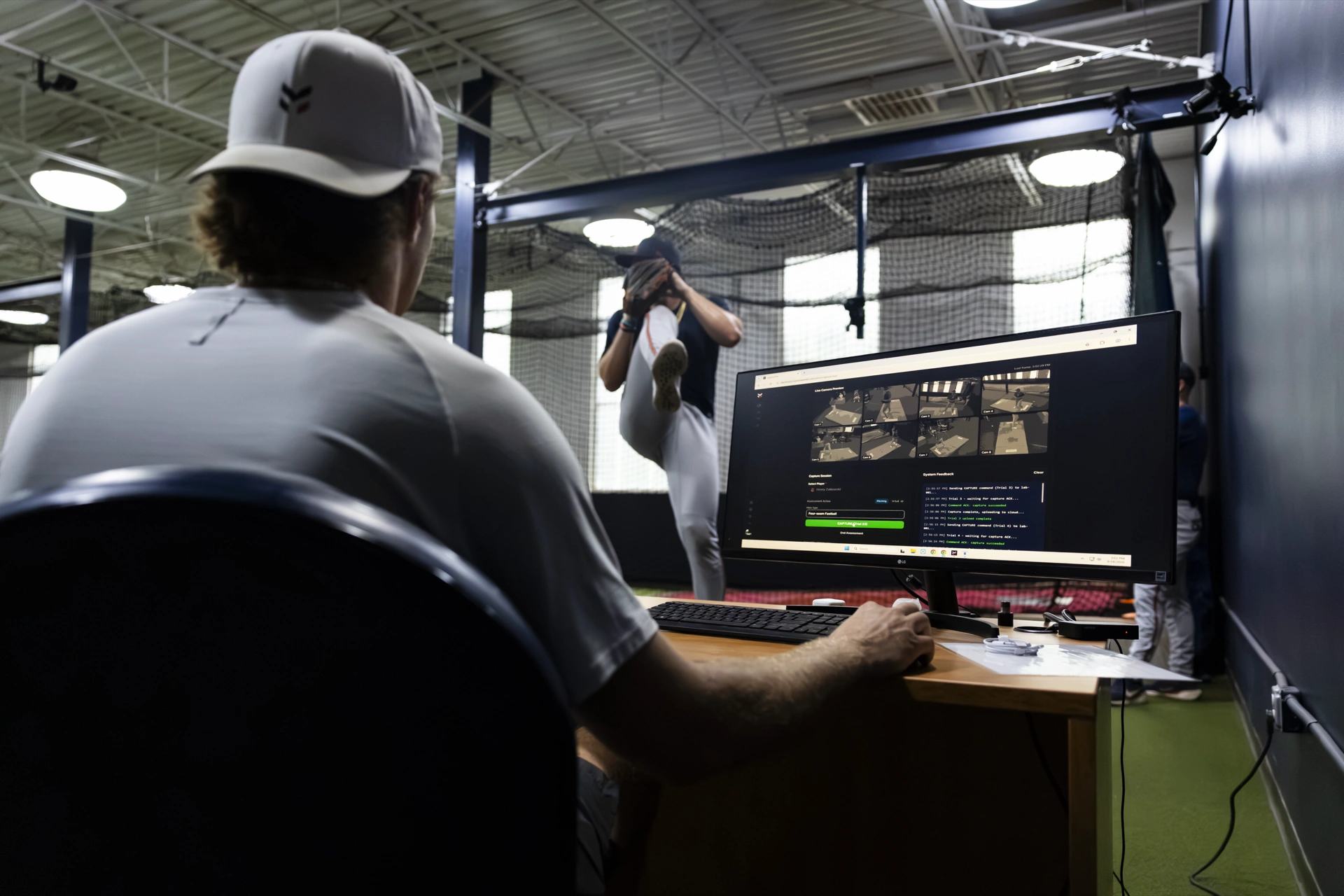 A Maven operator runs a live motion-capture session as a pitcher throws inside the Charlottesville lab